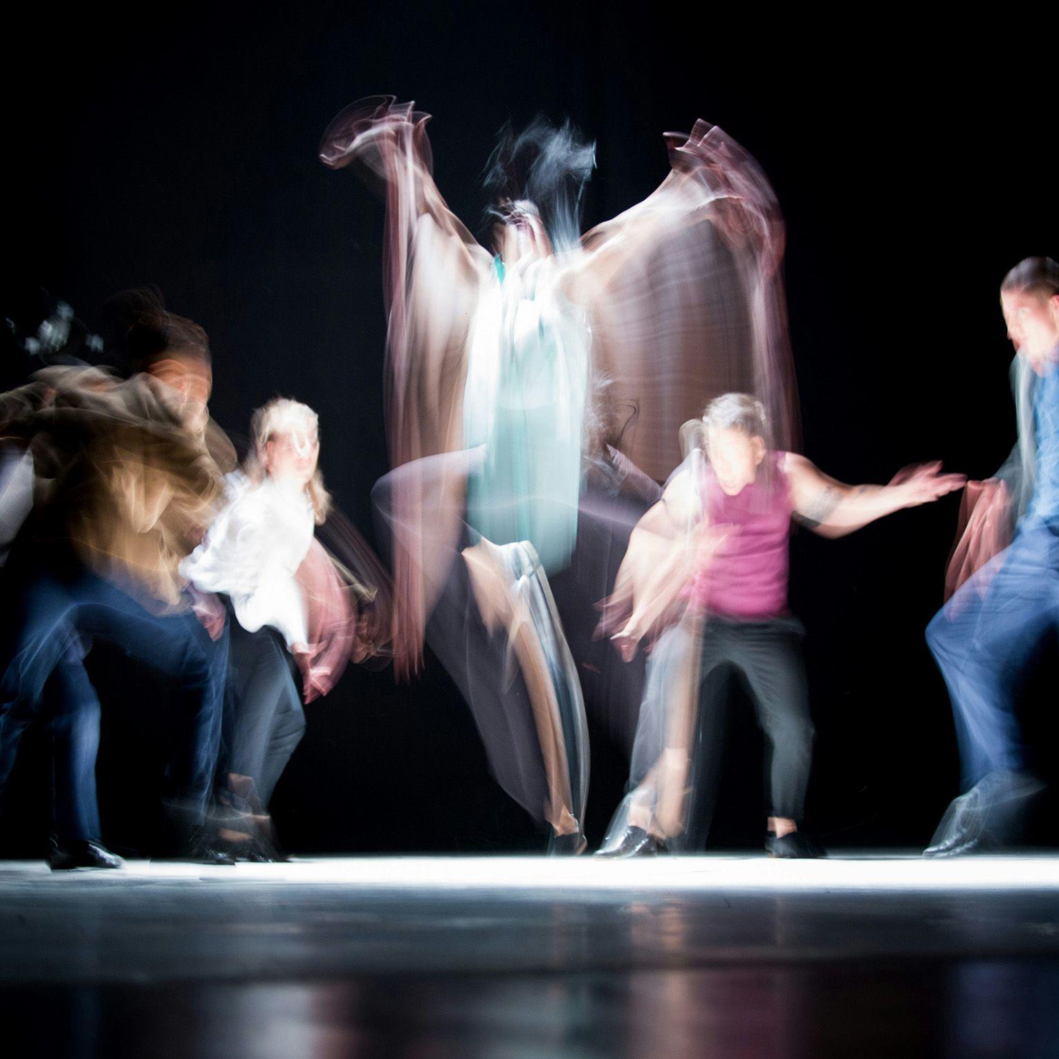 People on stage dancing